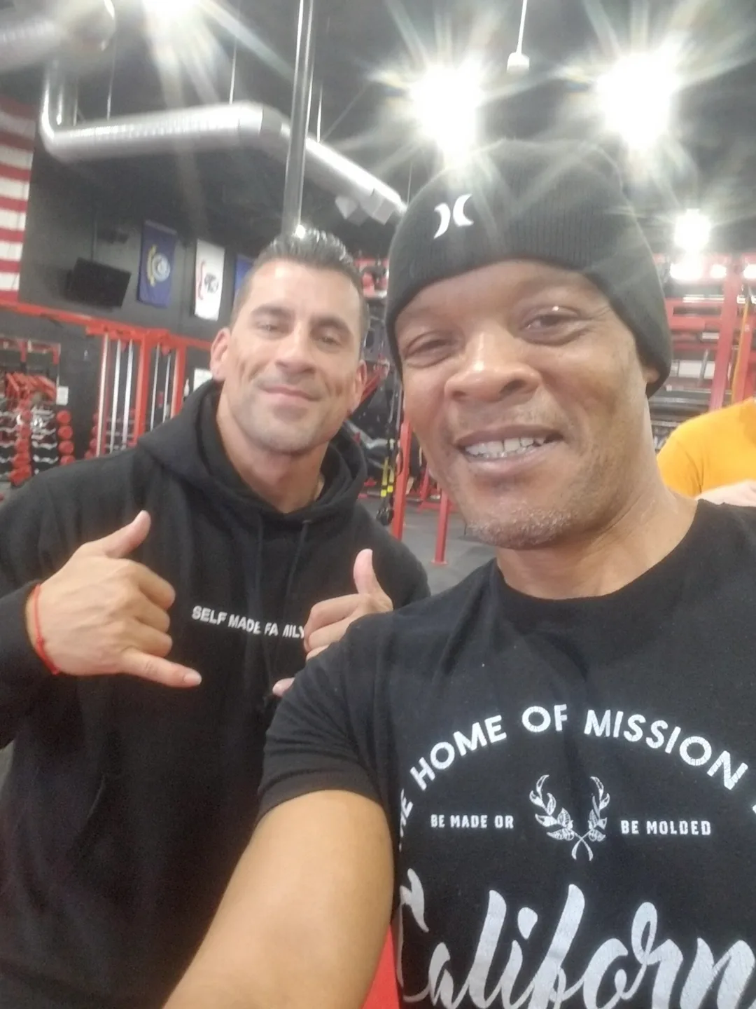 Coach Bizz with a member of the gym family