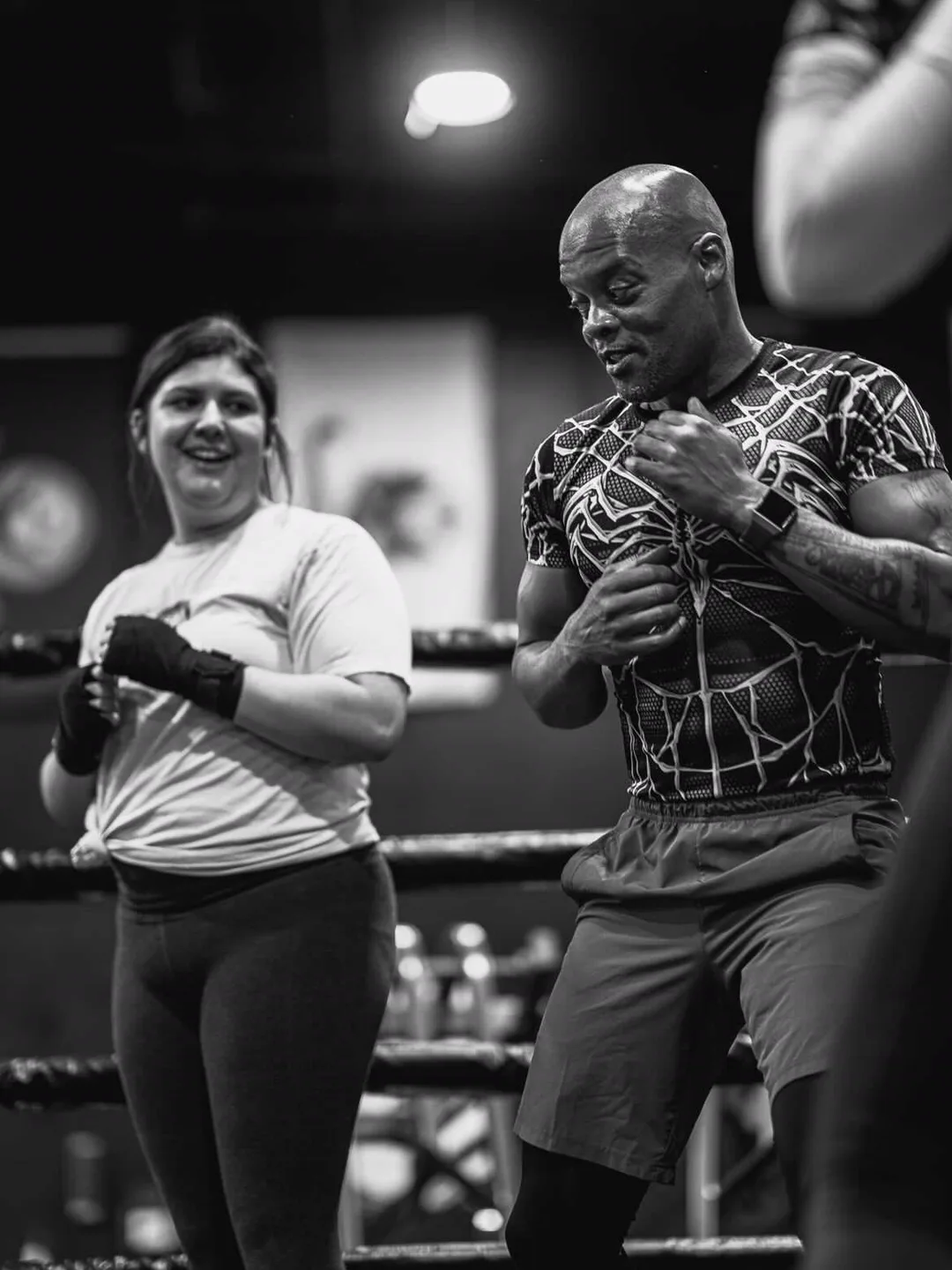 Coach Bizz coaching in the ring, black and white