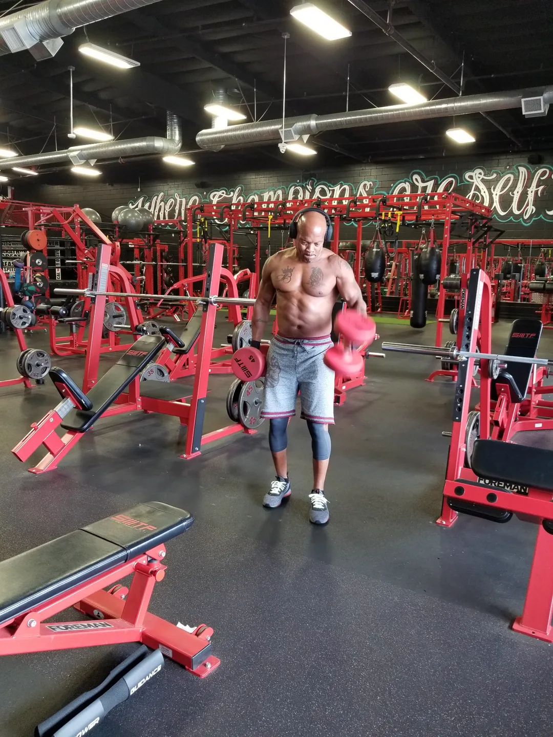 Coach Bizz curling dumbbells back in 2019 — the grind is nothing new