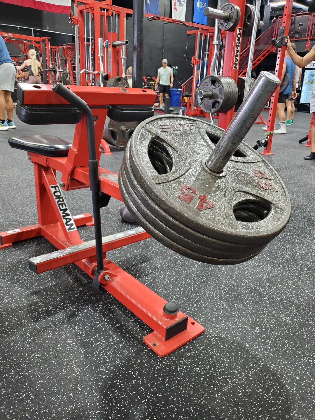 Loaded plates on the calf machine at Legacy Performance Institute